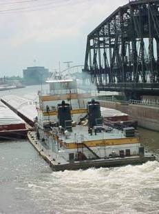 Grain barge, Mississippi River, Rock Island locks and bridge

